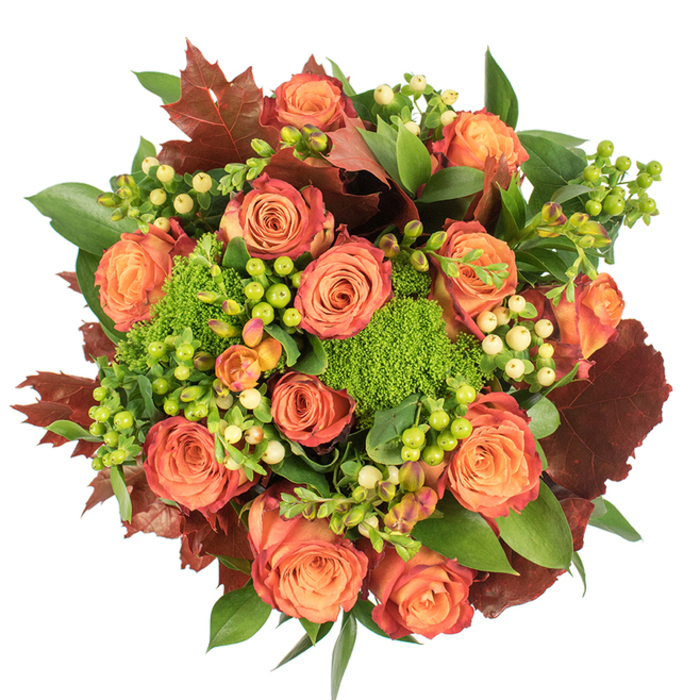 Viewed straight down against a white backdrop, this full, circular bouquet is a study in autumnal harmony, a composition I'd arrange at Florist Woodside to reflect the changing season. The central focus is a generous collection of roses, their blooms opening wide in warm peach and deep orange tones; each blossom graduates from a soft, honeyed core to petal edges touched with coral and a rusty red, like late September leaves catching the light. Interwoven among these roses are clusters of Hypericum berries - some a vivid lime green that seems to glow, others a soft cream or pale yellow that offers calm punctuation - their smooth, beadlike shapes adding cheerful punctuation and tactile contrast. Bright, cushiony Green Trick dianthus appears as dense, velvety green knots throughout the arrangement, lending an unexpected textural counterpoint that reads like miniature moss. Richly coloured, lobed leaves in burgundy and deep russet are placed intentionally to echo fallen woodside trees and to ground the palette, while shiny, broad green foliage supplies a lush underlayer that amplifies the sense of abundance. The bouquet is photographed under gentle, diffuse light which caresses the velvety petals and highlights the berries' gloss without harsh reflections, creating subtle depth and soft shadows. The overall effect is warm, comforting and refined - perfect for a Thanksgiving table, as a seasonal gift for neighbours on Woodside High Street, or to bring autumn's quiet richness into a home near Woodside Green.